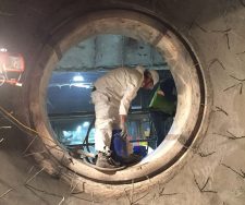 Man working inside a refractory at TMI Contractors